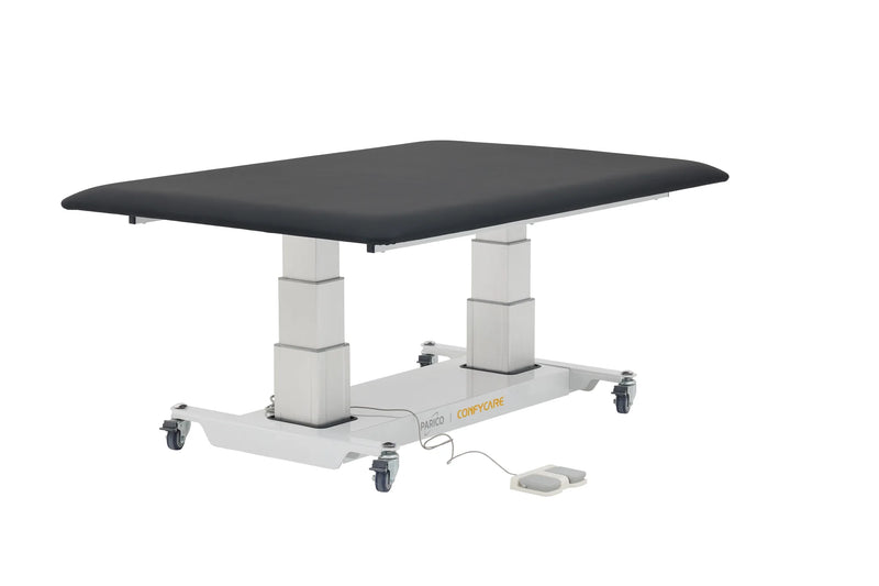 PARICO Coinfycare ELT100W bariatric hi-lo mat platform at raised height, three-quarter view with foot control