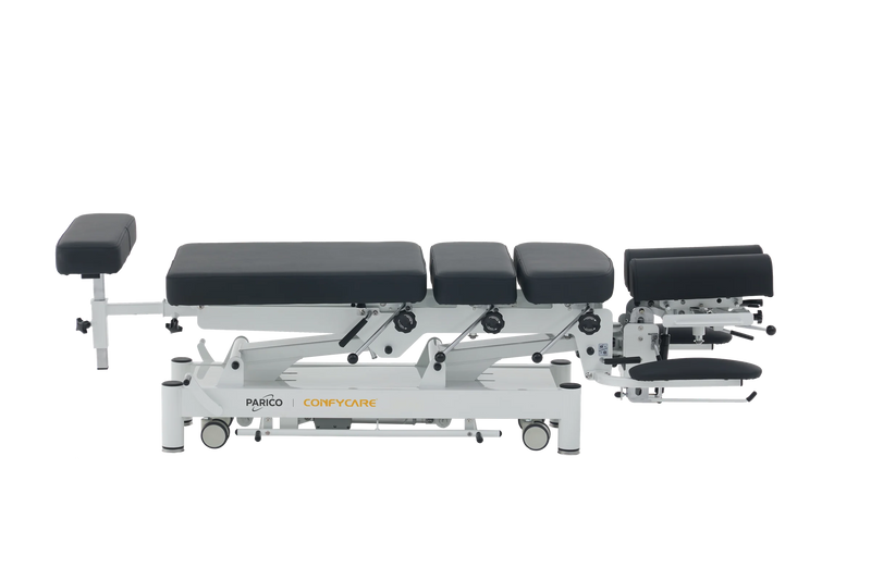 PARICO Coinfycare EL08PRO chiropractic drop table, side view at low height, Signal White frame, black upholstery